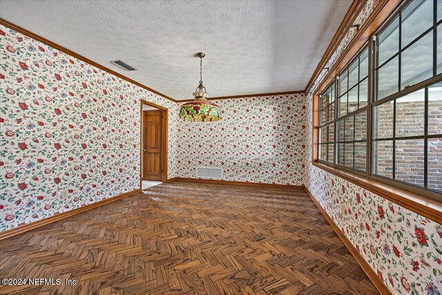 spare room with vaulted ceiling, crown molding, dark parquet floors, and a textured ceiling