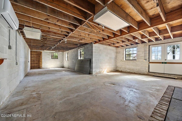 basement featuring an AC wall unit