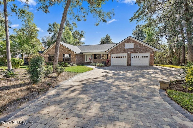 single story home featuring a garage