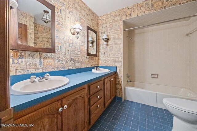 full bathroom with toilet, vanity, tile patterned floors, and shower / bathtub combination