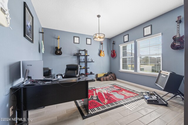 office space with light wood-type flooring