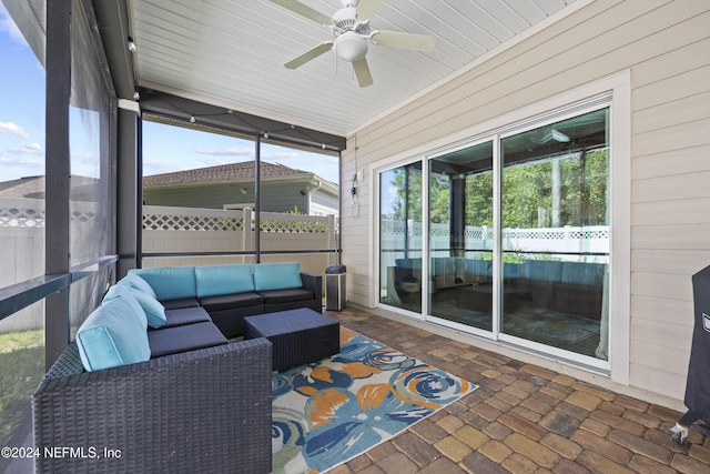 sunroom / solarium featuring ceiling fan and a wealth of natural light