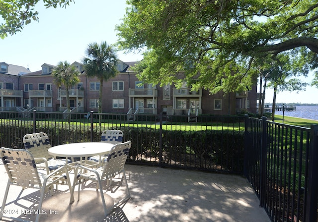 view of patio with a water view