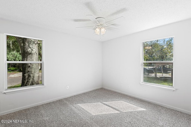 unfurnished room with carpet, a textured ceiling, and ceiling fan