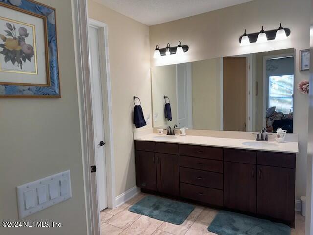 bathroom featuring tile patterned floors and vanity