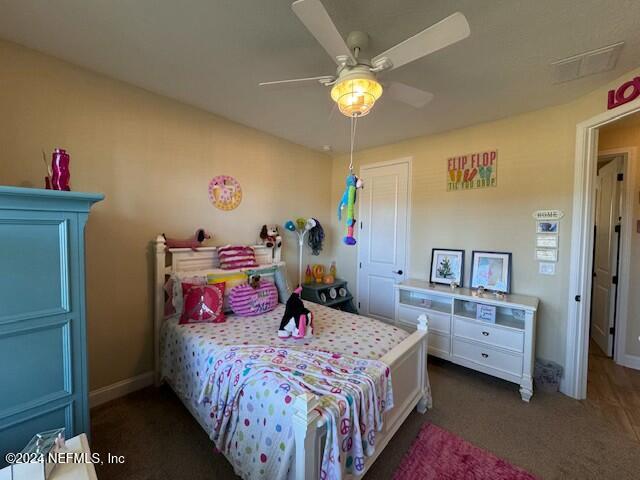 carpeted bedroom with ceiling fan