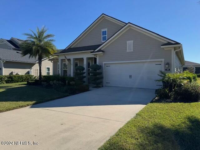211 Dolcetto Dr, Saint Augustine, FL 32092 - view of front of home with driveway, a front lawn, and an attached garage