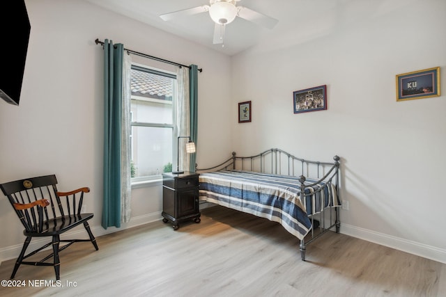 bedroom featuring light wood-type flooring and ceiling fan