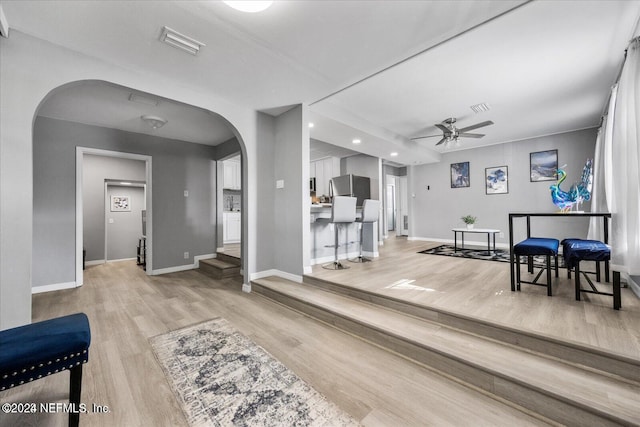 interior space with ceiling fan and light wood-type flooring