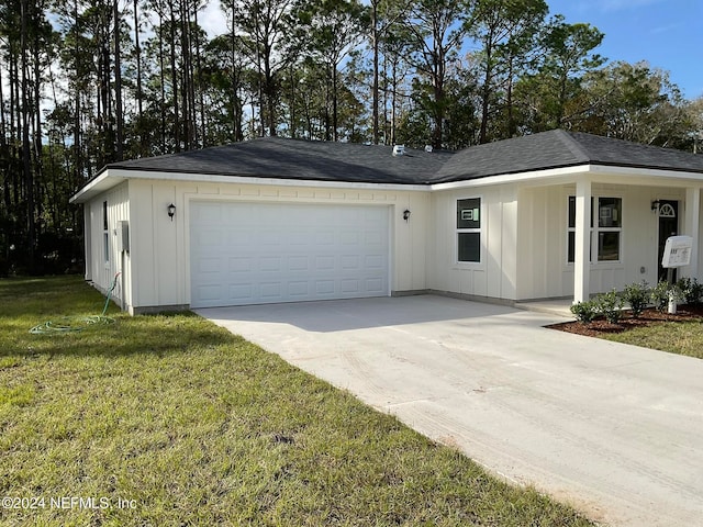 ranch-style house with a front yard and a garage