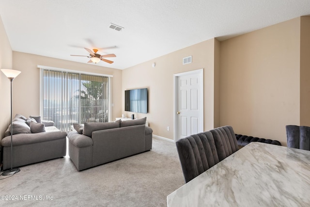 7801 Point Meadows Dr Unit 8406, Jacksonville, FL 32256 - carpeted living room featuring a ceiling fan, baseboards, and visible vents