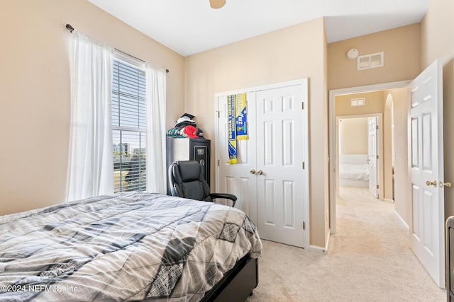 7801 Point Meadows Dr Unit 8406, Jacksonville, FL 32256 - bedroom featuring light colored carpet, a closet, visible vents, and baseboards