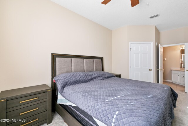 7801 Point Meadows Dr Unit 8406, Jacksonville, FL 32256 - bedroom featuring ceiling fan, light carpet, ensuite bathroom, and visible vents