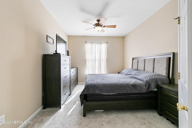 7801 Point Meadows Dr Unit 8406, Jacksonville, FL 32256 - bedroom with baseboards, ceiling fan, and light colored carpet