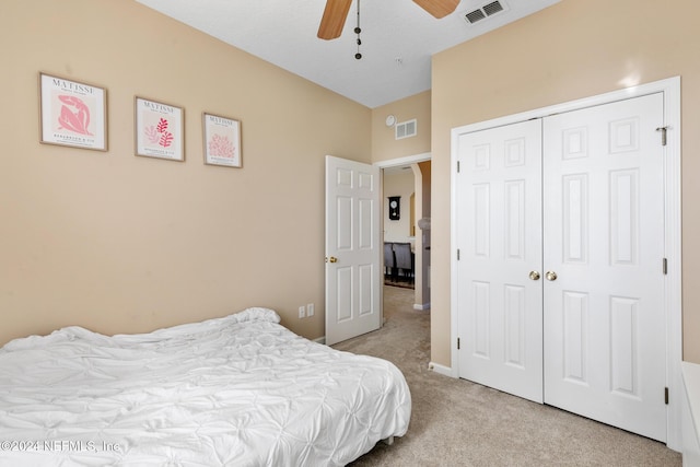 7801 Point Meadows Dr Unit 8406, Jacksonville, FL 32256 - bedroom featuring light colored carpet, a closet, visible vents, and a ceiling fan