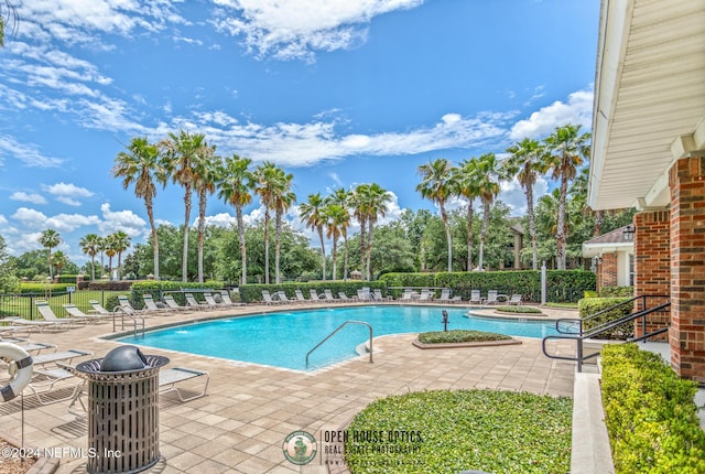 7801 Point Meadows Dr Unit 8406, Jacksonville, FL 32256 - community pool with a patio and fence