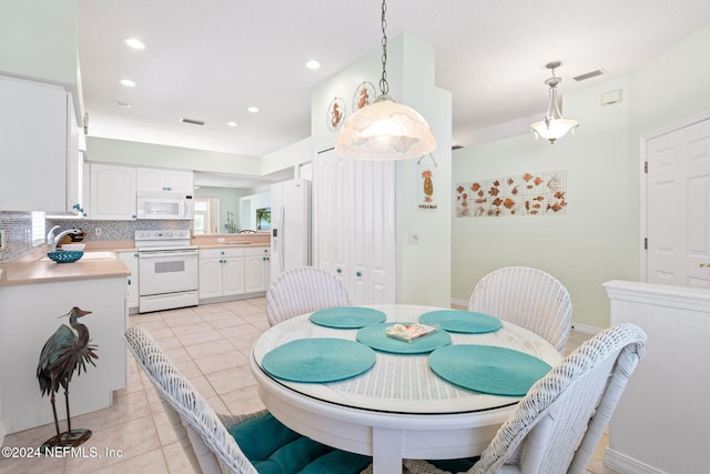 193 Lions Gate Dr, Saint Augustine, FL 32080 - dining area with light tile patterned floors and recessed lighting