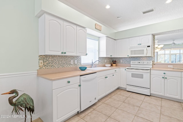 193 Lions Gate Dr, Saint Augustine, FL 32080 - kitchen featuring white appliances, a sink, plenty of natural light, and tasteful backsplash