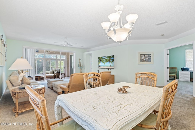 193 Lions Gate Dr, Saint Augustine, FL 32080 - dining space featuring light colored carpet, a chandelier, a textured ceiling, and ceiling fan