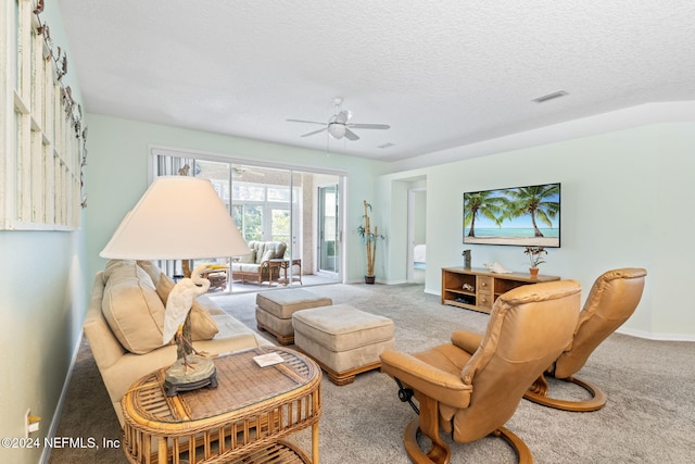 193 Lions Gate Dr, Saint Augustine, FL 32080 - carpeted living area with a ceiling fan, baseboards, and a textured ceiling