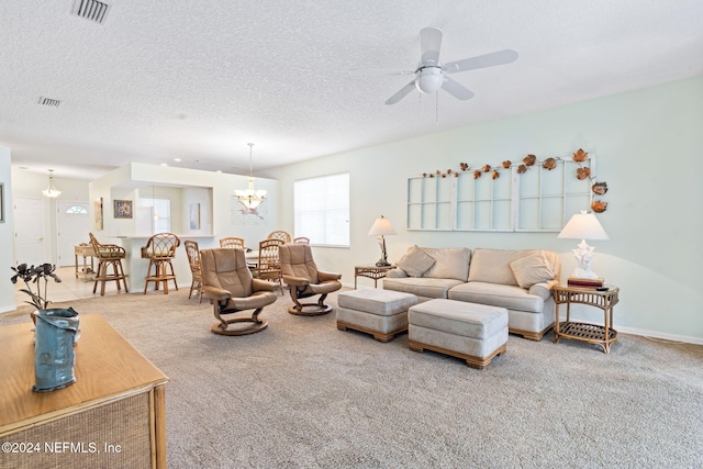 193 Lions Gate Dr, Saint Augustine, FL 32080 - living area with carpet, a ceiling fan, a chandelier, and a textured ceiling