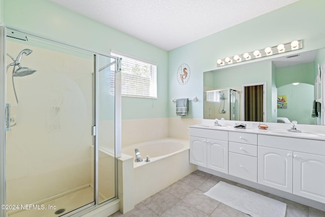 193 Lions Gate Dr, Saint Augustine, FL 32080 - bathroom with a stall shower, a garden tub, double vanity, tile patterned flooring, and a textured ceiling