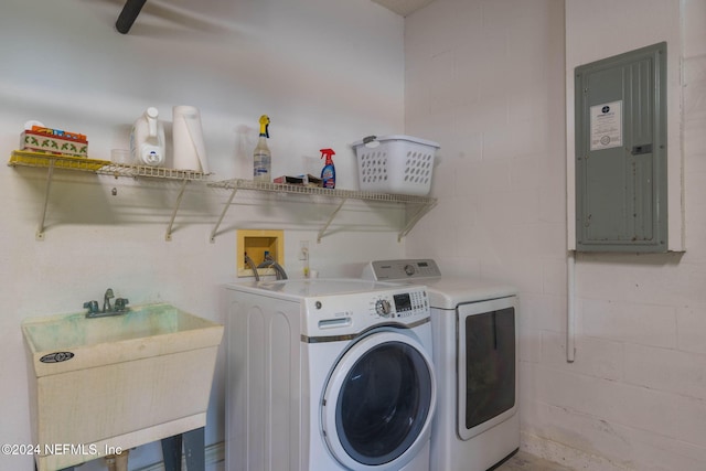 193 Lions Gate Dr, Saint Augustine, FL 32080 - laundry room with electric panel, washer and dryer, and concrete block wall