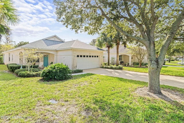 193 Lions Gate Dr, Saint Augustine, FL 32080 - ranch-style home with an attached garage, a front yard, concrete driveway, stucco siding, and a shingled roof
