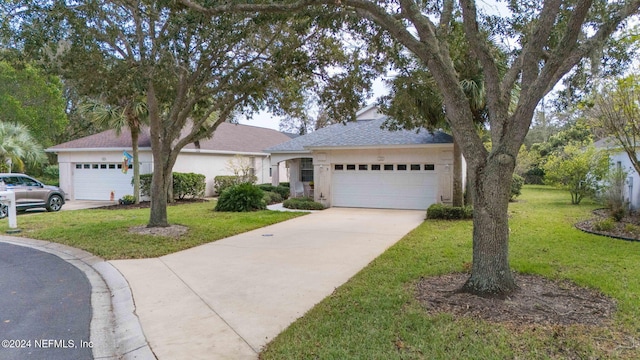 193 Lions Gate Dr, Saint Augustine, FL 32080 - single story home featuring a front lawn, a garage, driveway, and roof with shingles
