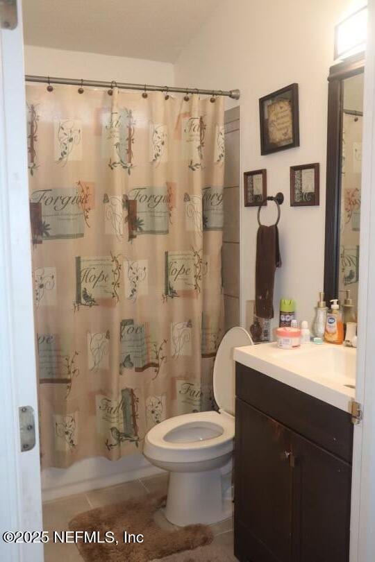 full bathroom featuring toilet, shower / bathtub combination with curtain, tile patterned flooring, and vanity