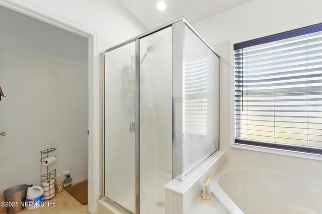 694 Cherry Bark Dr N, Jacksonville, FL 32218 - bathroom with tile patterned flooring, recessed lighting, a bath, and a shower stall