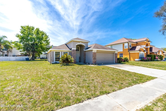 694 Cherry Bark Dr N, Jacksonville, FL 32218 - view of front of property featuring a garage, fence, a front yard, and concrete driveway