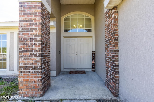 694 Cherry Bark Dr N, Jacksonville, FL 32218 - property entrance with stucco siding and brick siding