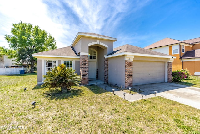 694 Cherry Bark Dr N, Jacksonville, FL 32218 - single story home featuring an attached garage, brick siding, driveway, and a front yard