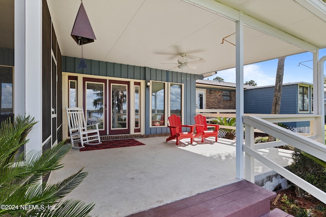 sunroom / solarium with a wealth of natural light and ceiling fan