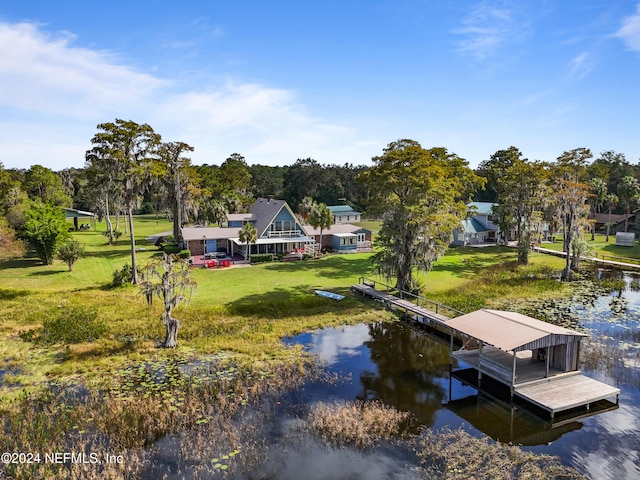 dock area featuring a water view and a yard