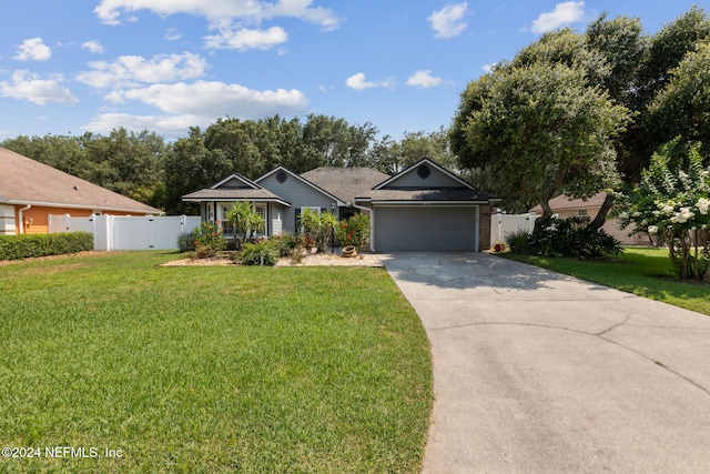 ranch-style house with a garage and a front lawn