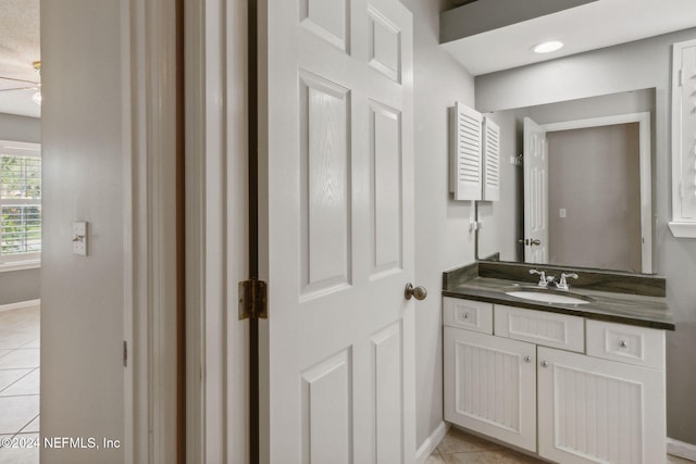 bathroom with vanity and tile patterned flooring