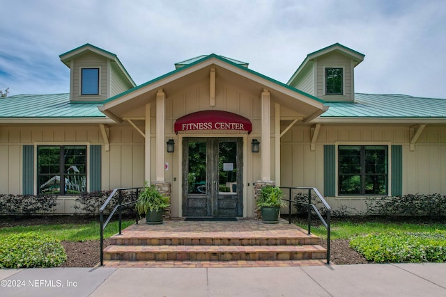 property entrance featuring french doors