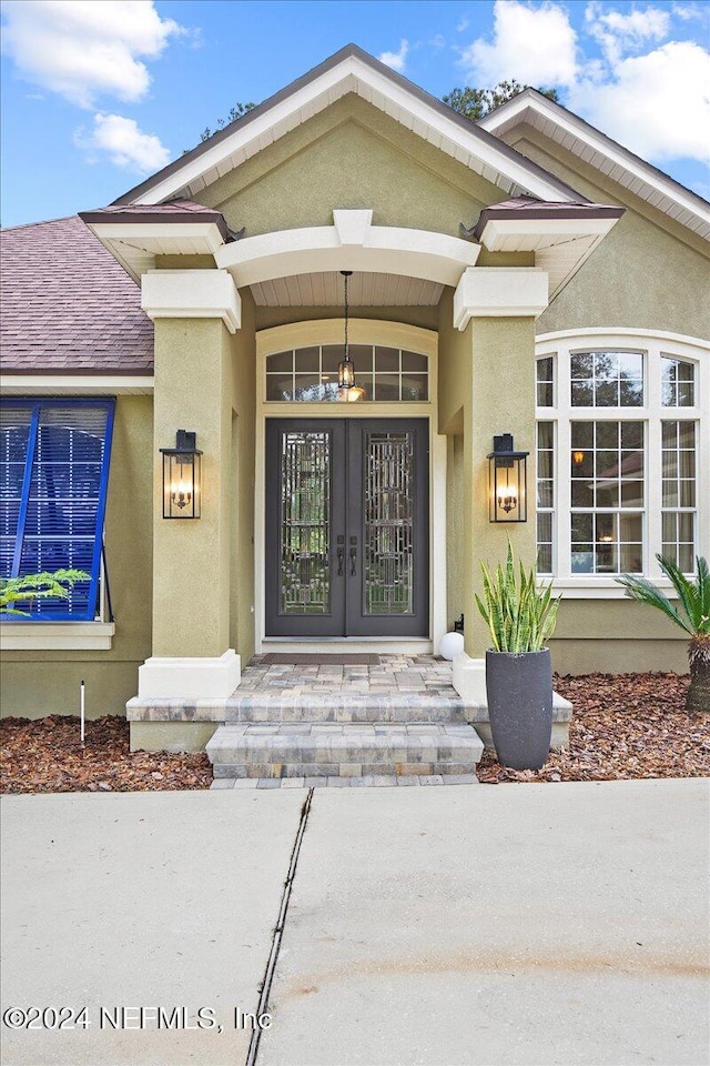 entrance to property featuring french doors