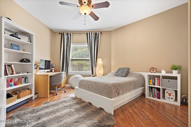 bedroom with ceiling fan and wood-type flooring