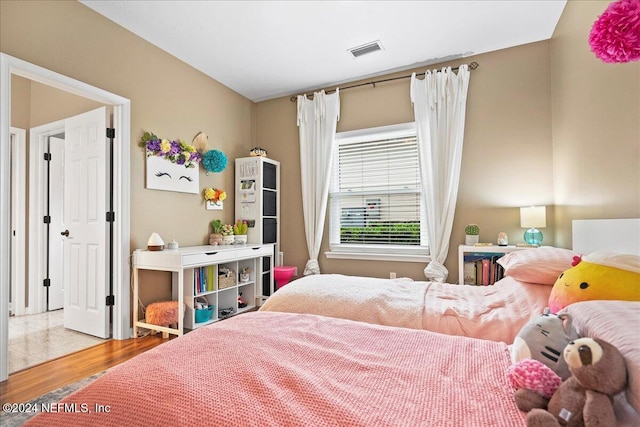 bedroom featuring hardwood / wood-style floors