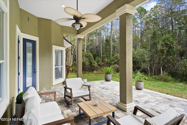 view of patio with ceiling fan and an outdoor hangout area