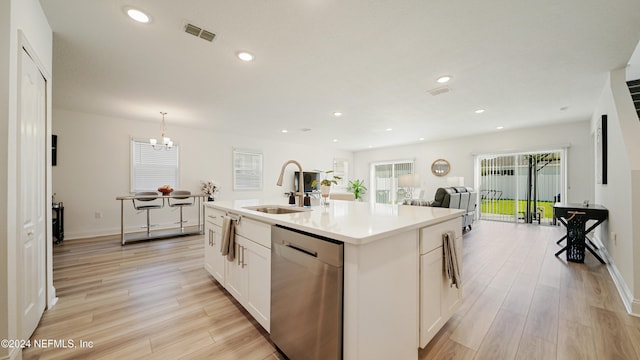 kitchen with a center island with sink, sink, white cabinets, dishwasher, and light hardwood / wood-style flooring