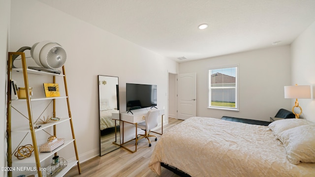 bedroom with light wood-type flooring