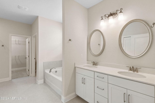 bathroom featuring vanity and a tub