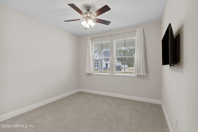 empty room with carpet flooring and ceiling fan