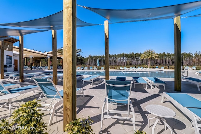 view of patio / terrace featuring a community pool