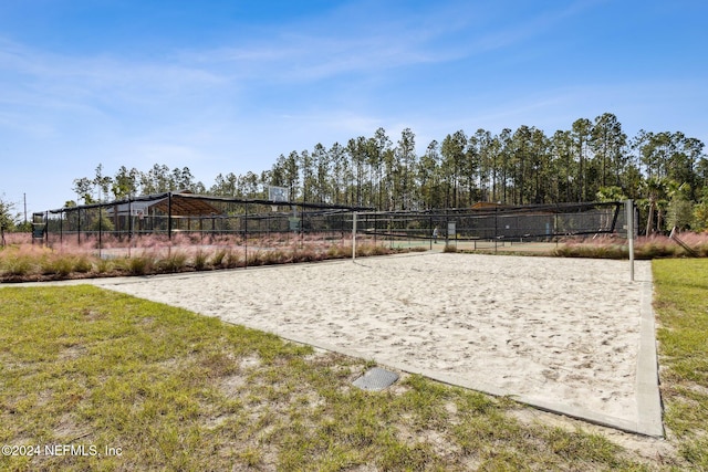 view of home's community featuring volleyball court and a lawn