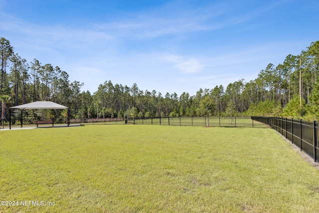 view of yard featuring a gazebo and a rural view